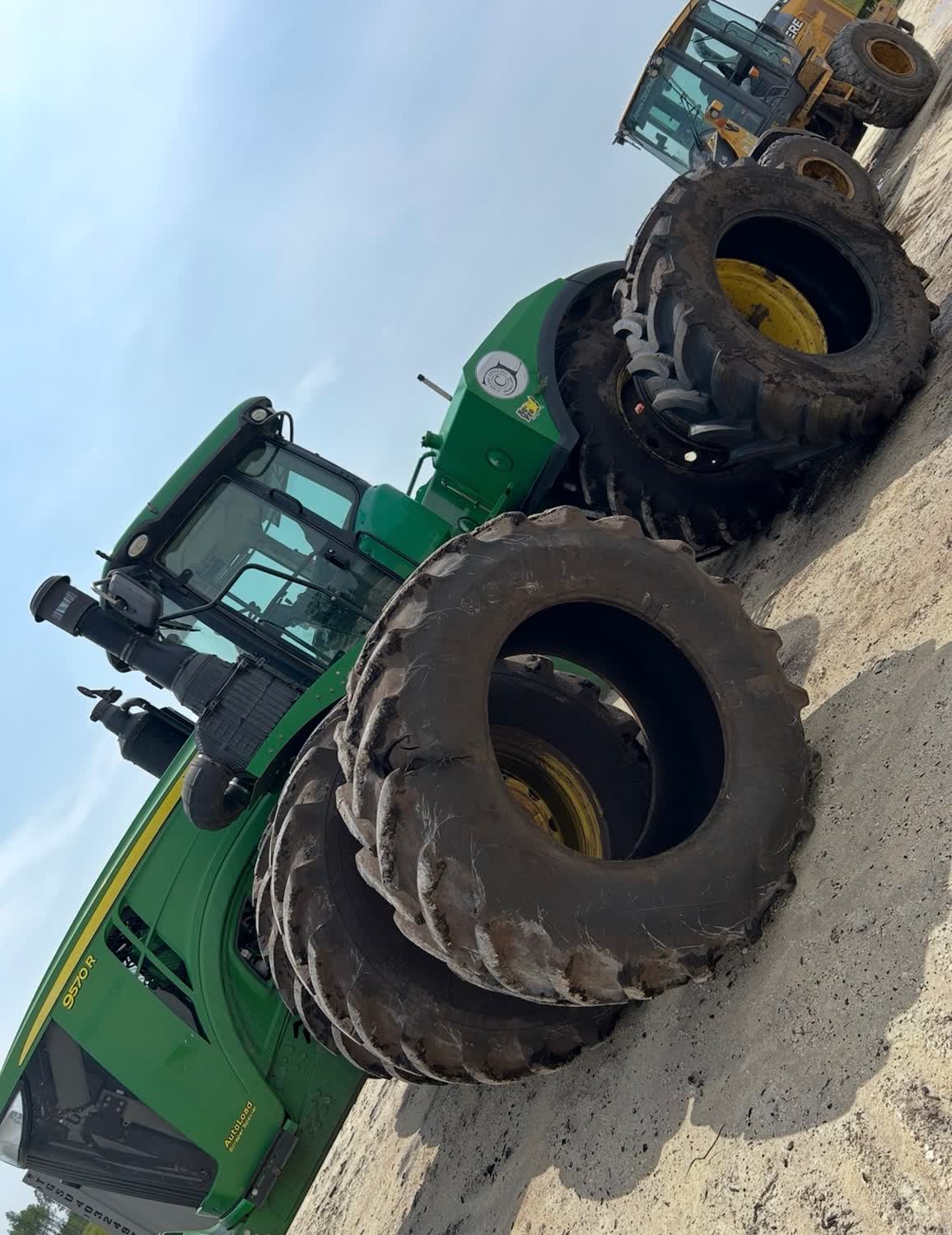 John Deere 9570R tractor dual tire replacement in the field