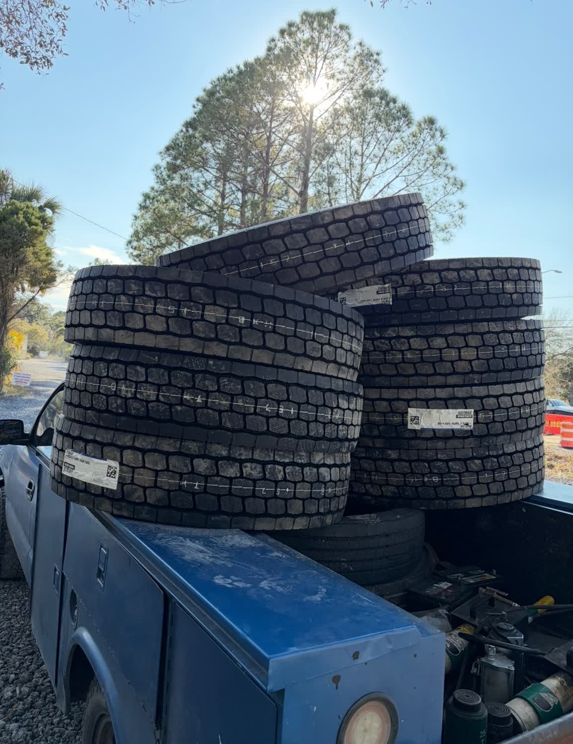 New semi-truck drive tires stacked on the mobile service truck