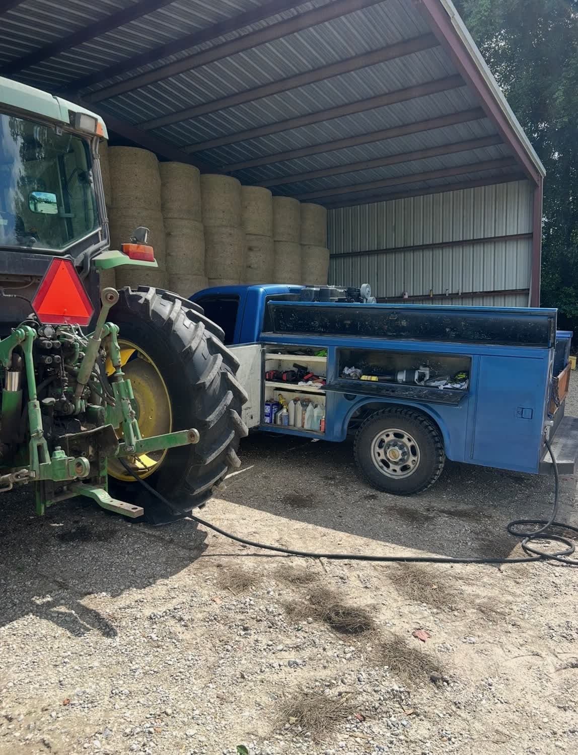 Tractor tire service at a hay barn on a farm near High Springs FL