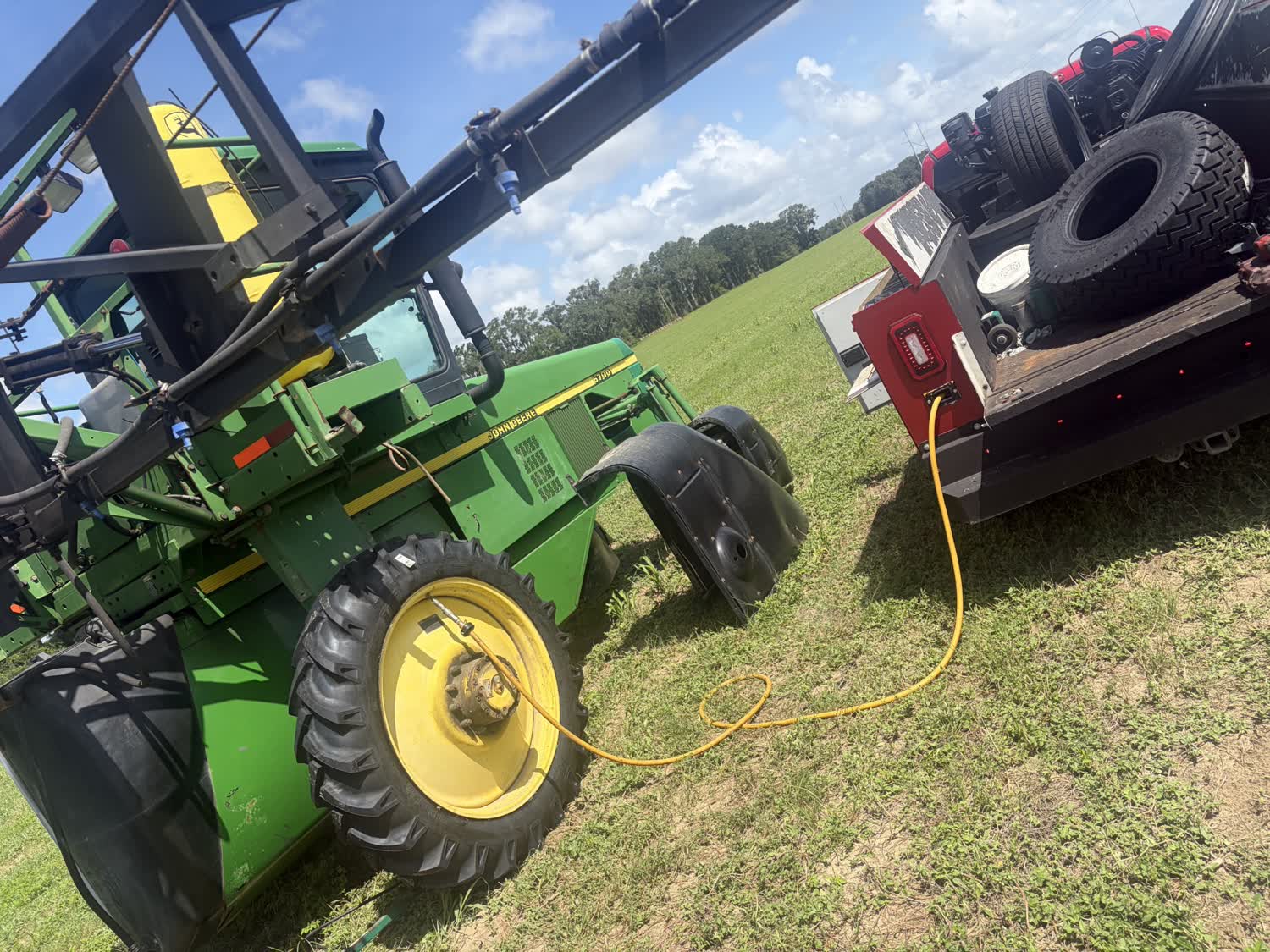 John Deere sprayer tire repair in the field with mobile air service