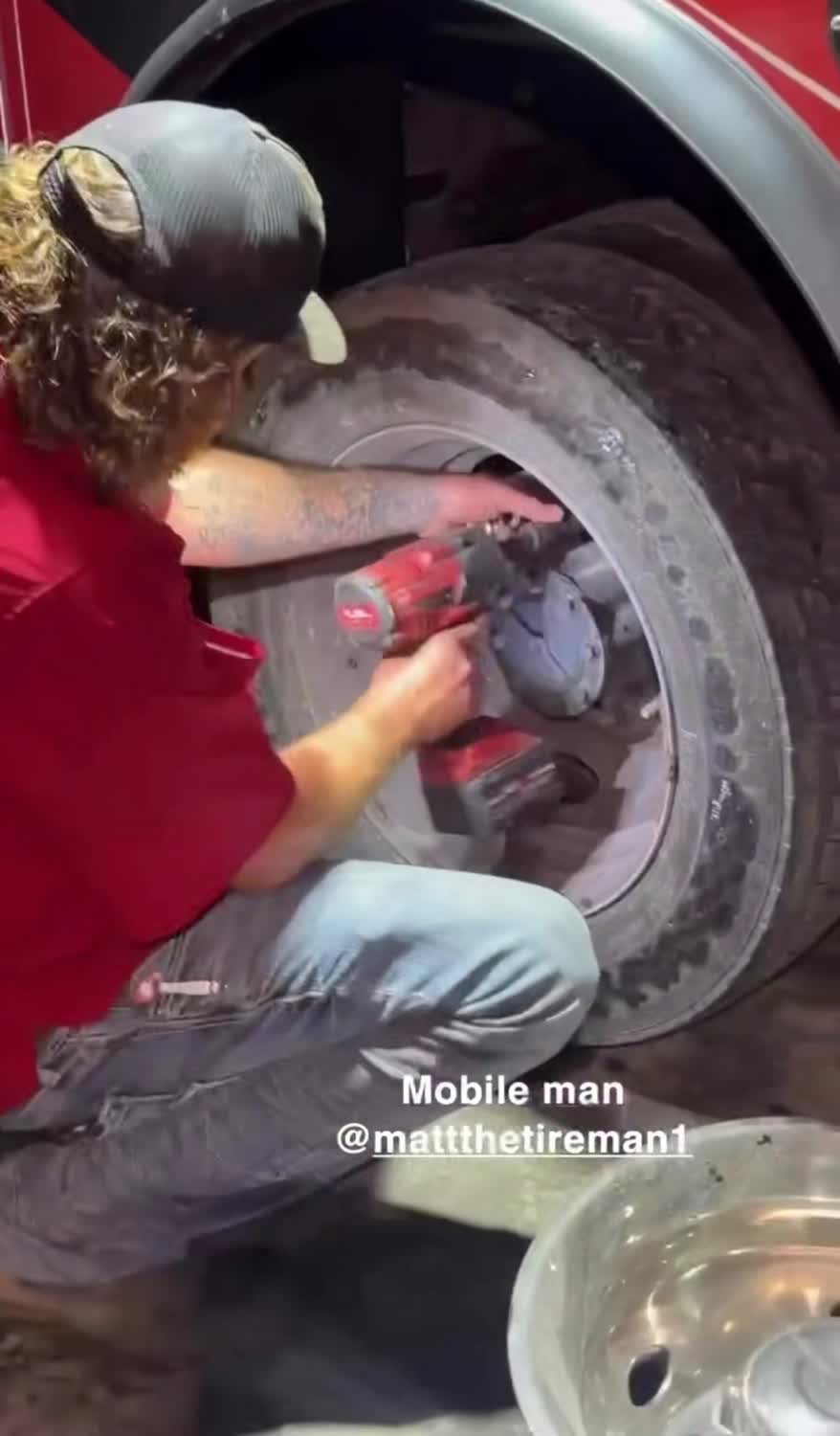 Mobile RV tire service - torquing a motorhome wheel at night